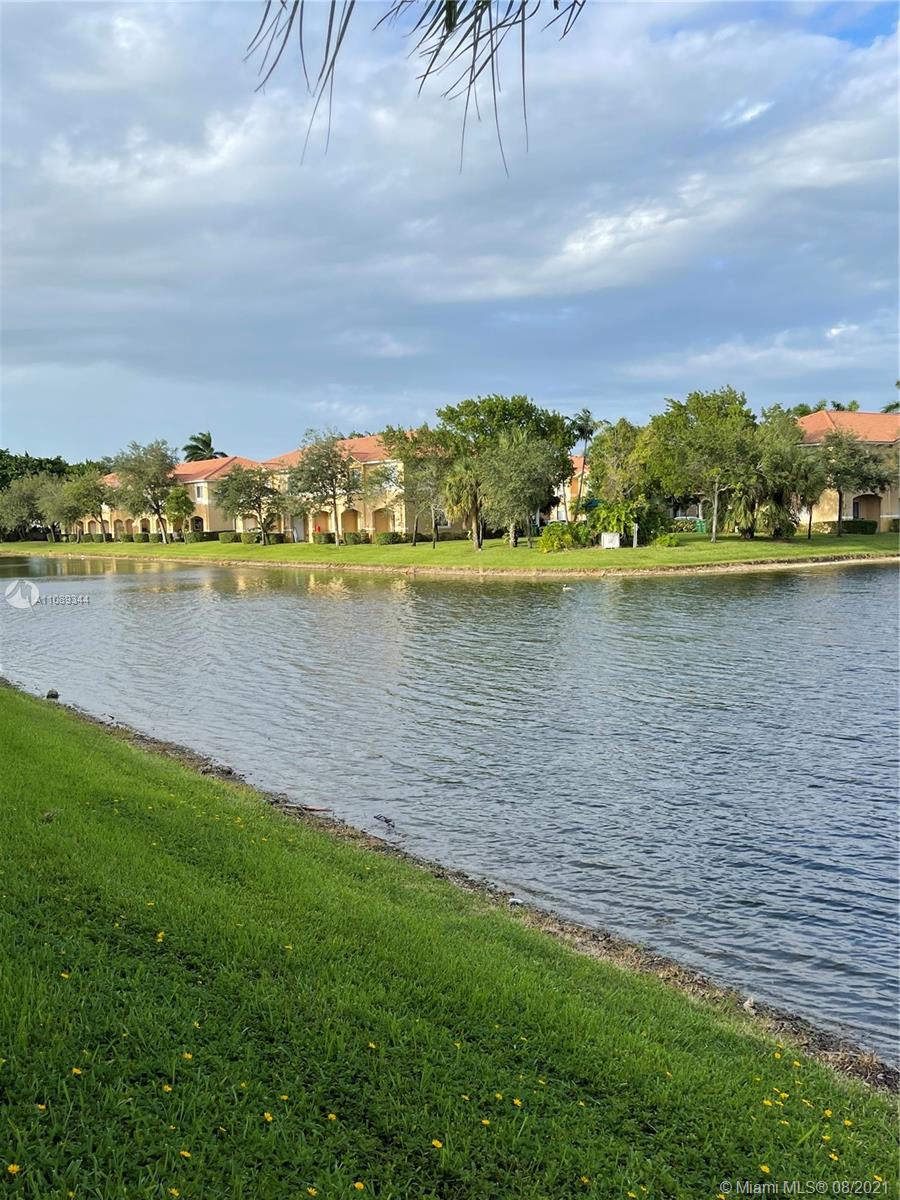 5924 Abbey Road Tamarac, FL 33321 - Photo 20 of 44 a view of a lake with houses in the back
