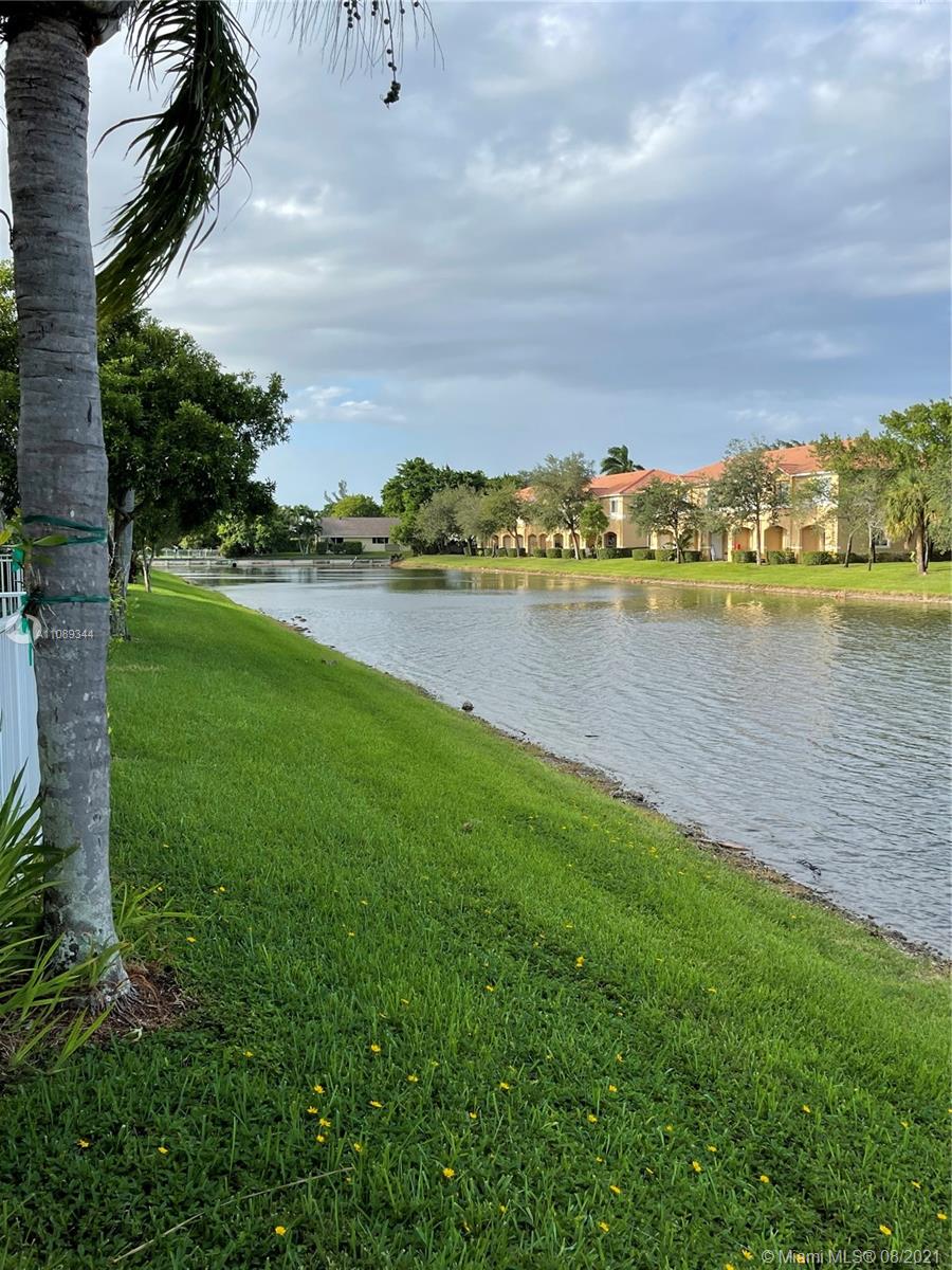 5924 Abbey Road Tamarac, FL 33321 - Photo 21 of 44 a view of a lake with houses in the back