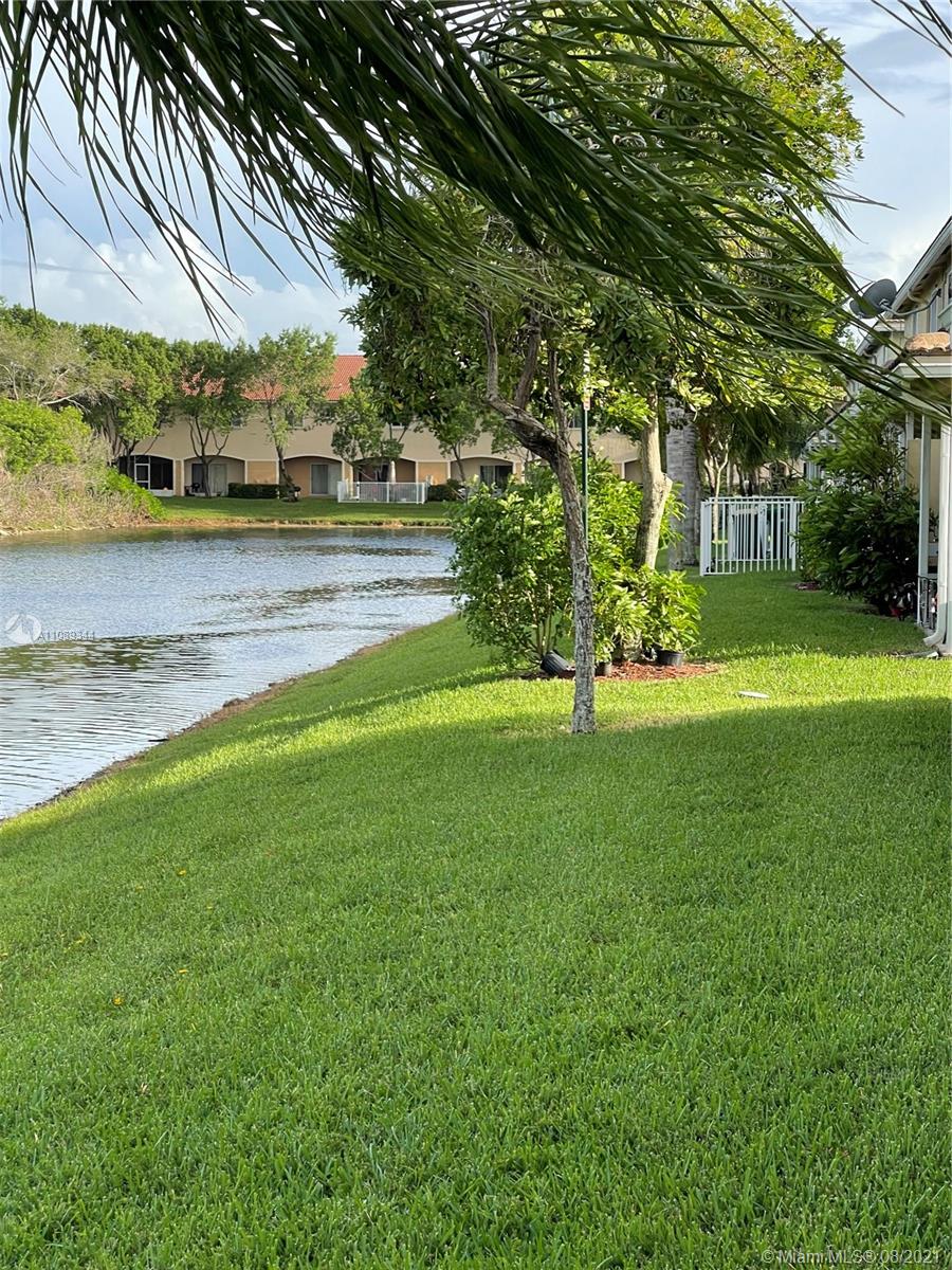 5924 Abbey Road Tamarac, FL 33321 - Photo 22 of 44 a view of a garden with trees