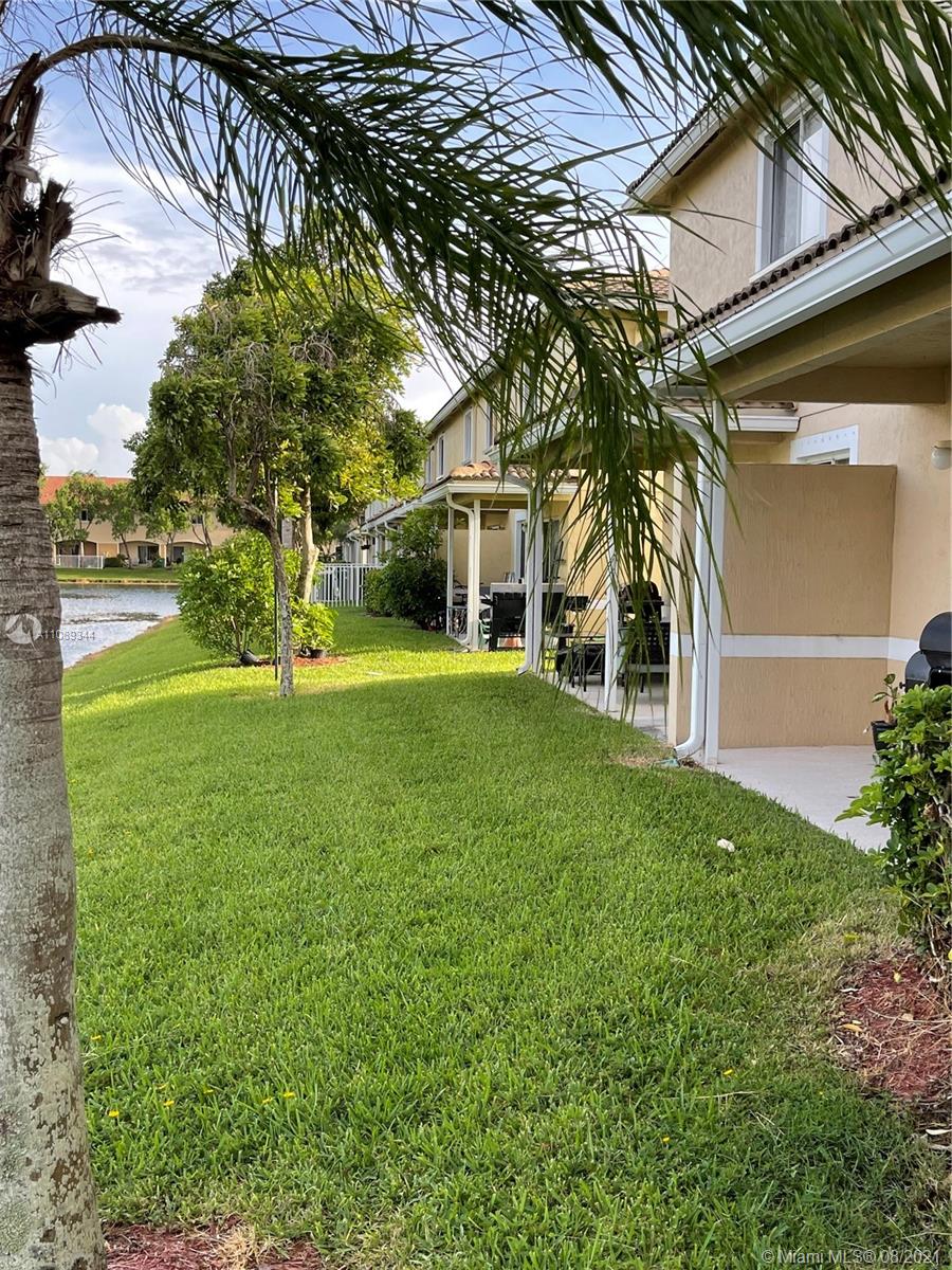 5924 Abbey Road Tamarac, FL 33321 - Photo 23 of 44 a view of a house with a yard