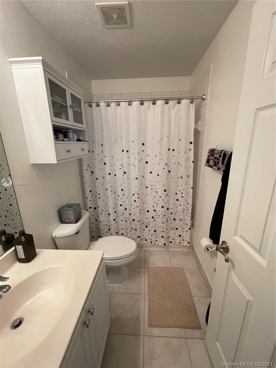 5924 Abbey Road Tamarac, FL 33321 - Photo 34 of 44 a bathroom with a sink a toilet and shower