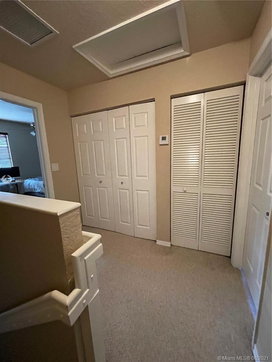 5924 Abbey Road Tamarac, FL 33321 - Photo 36 of 44 a view of room with furniture and wooden floor