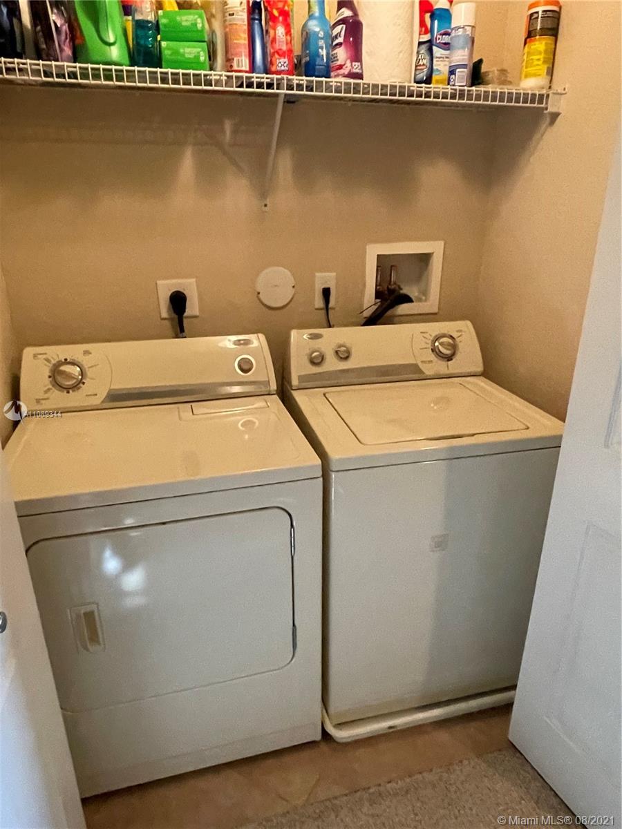 5924 Abbey Road Tamarac, FL 33321 - Photo 39 of 44 a utility room with dryer and washer