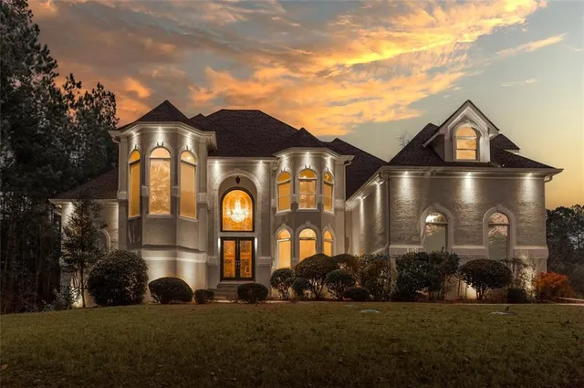 a front view of a house with a yard