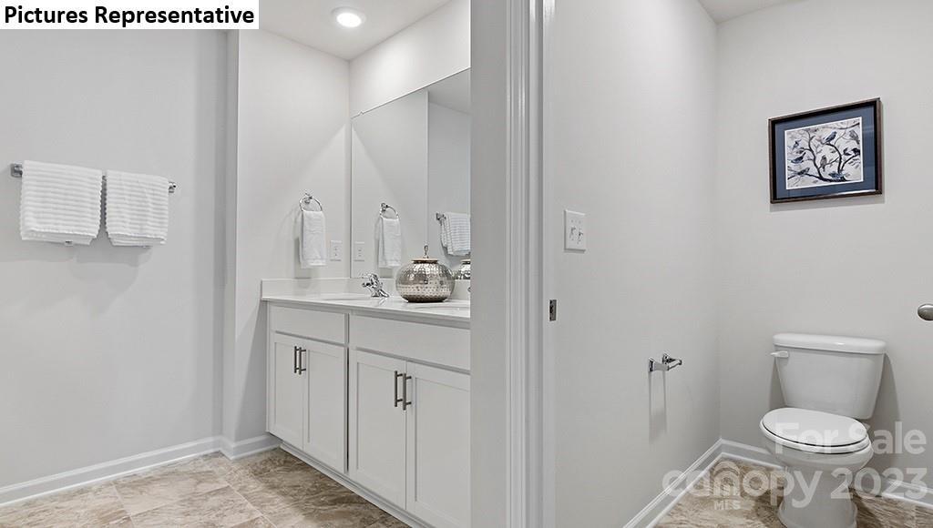 5035 Fandango Road York, SC 29745 - Photo 15 of 35 a bathroom with a toilet sink and mirror