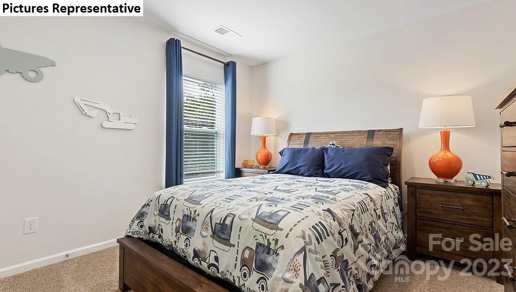 5035 Fandango Road York, SC 29745 - Photo 23 of 35 a bedroom with a bed and dresser