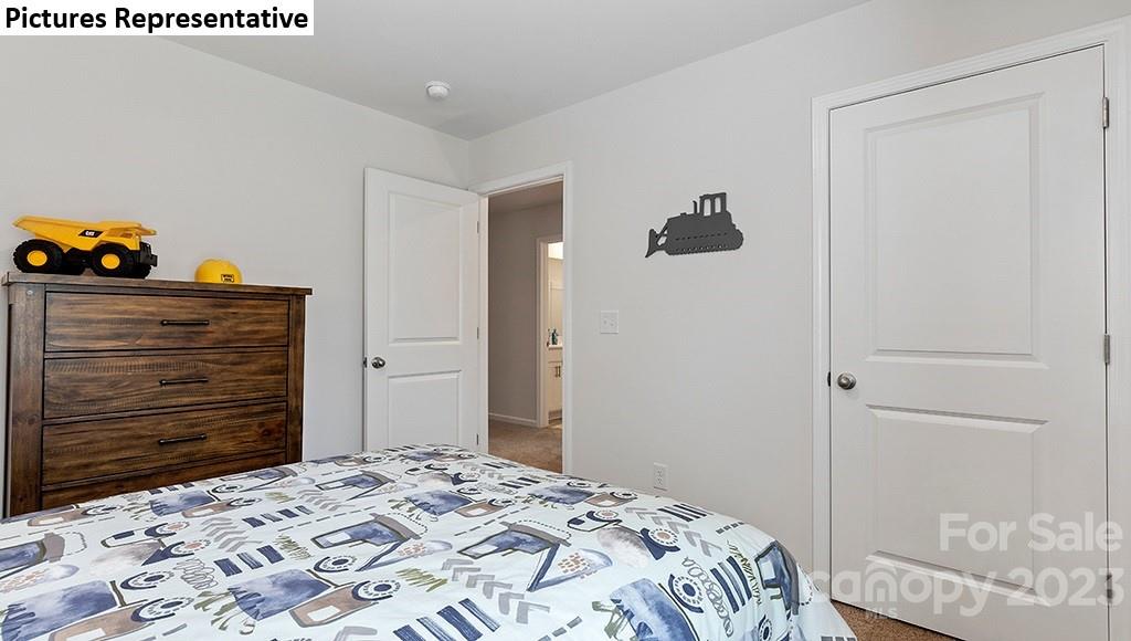 5035 Fandango Road York, SC 29745 - Photo 24 of 35 a bedroom with a bed and a dresser
