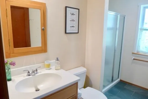 a bathroom with a sink toilet and bathtub