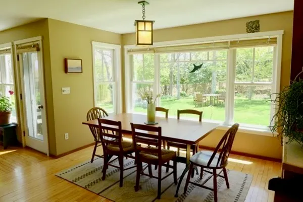 a view of a dining room with furniture window and outside view