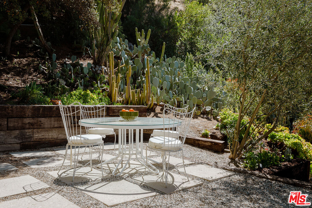 2544 Greenvalley Road Los Angeles, CA 90046 - Photo 51 of 56 a view of a chairs and table in backyard