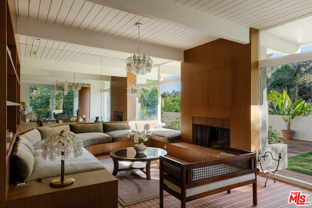 2544 Greenvalley Road Los Angeles, CA 90046 - Photo 6 of 56 a living room with furniture fireplace and a large window