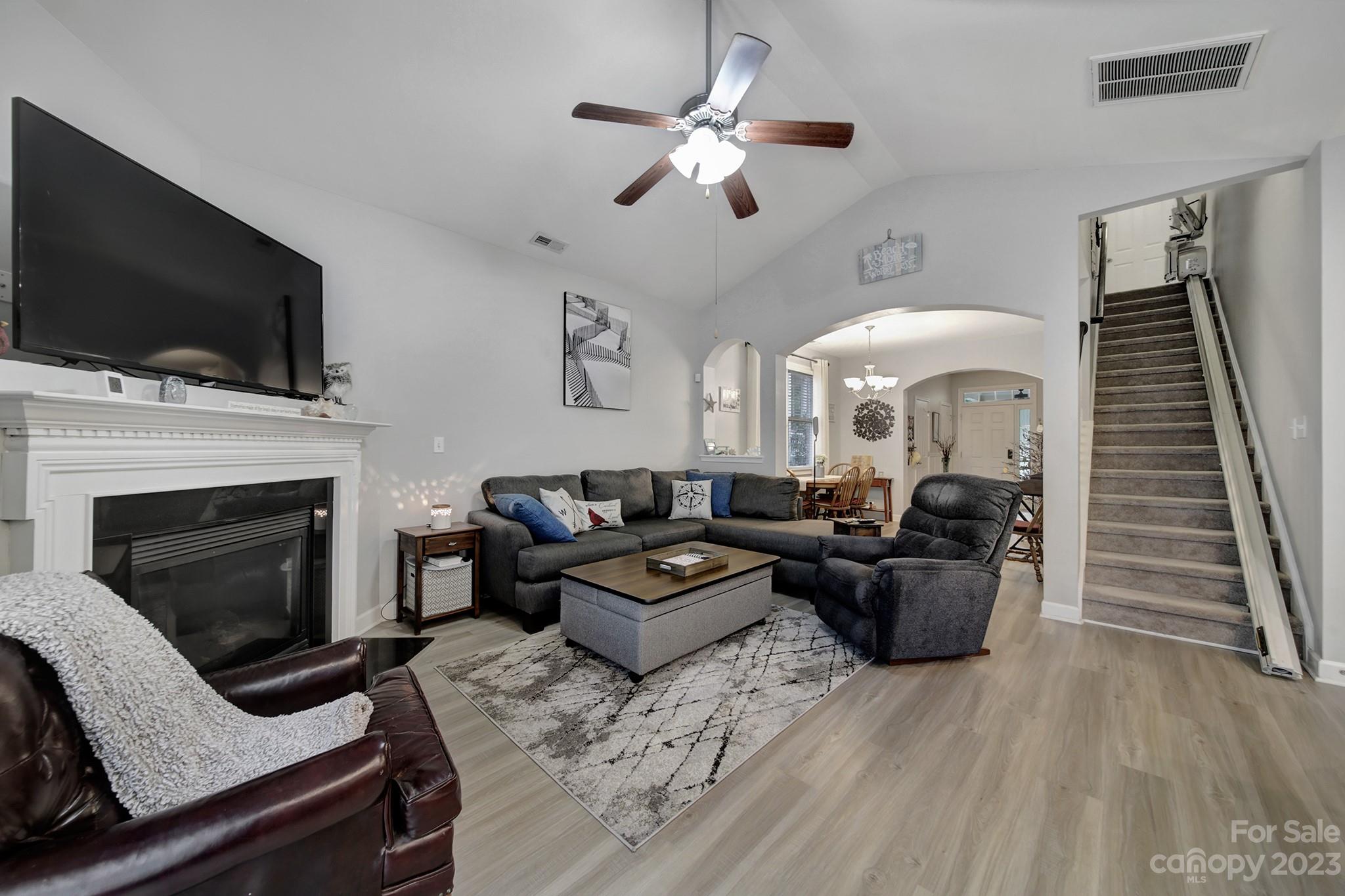 1079 Market Street Fort Mill, SC 29708 - Photo 12 of 46 a living room with furniture a flat screen tv and a fireplace
