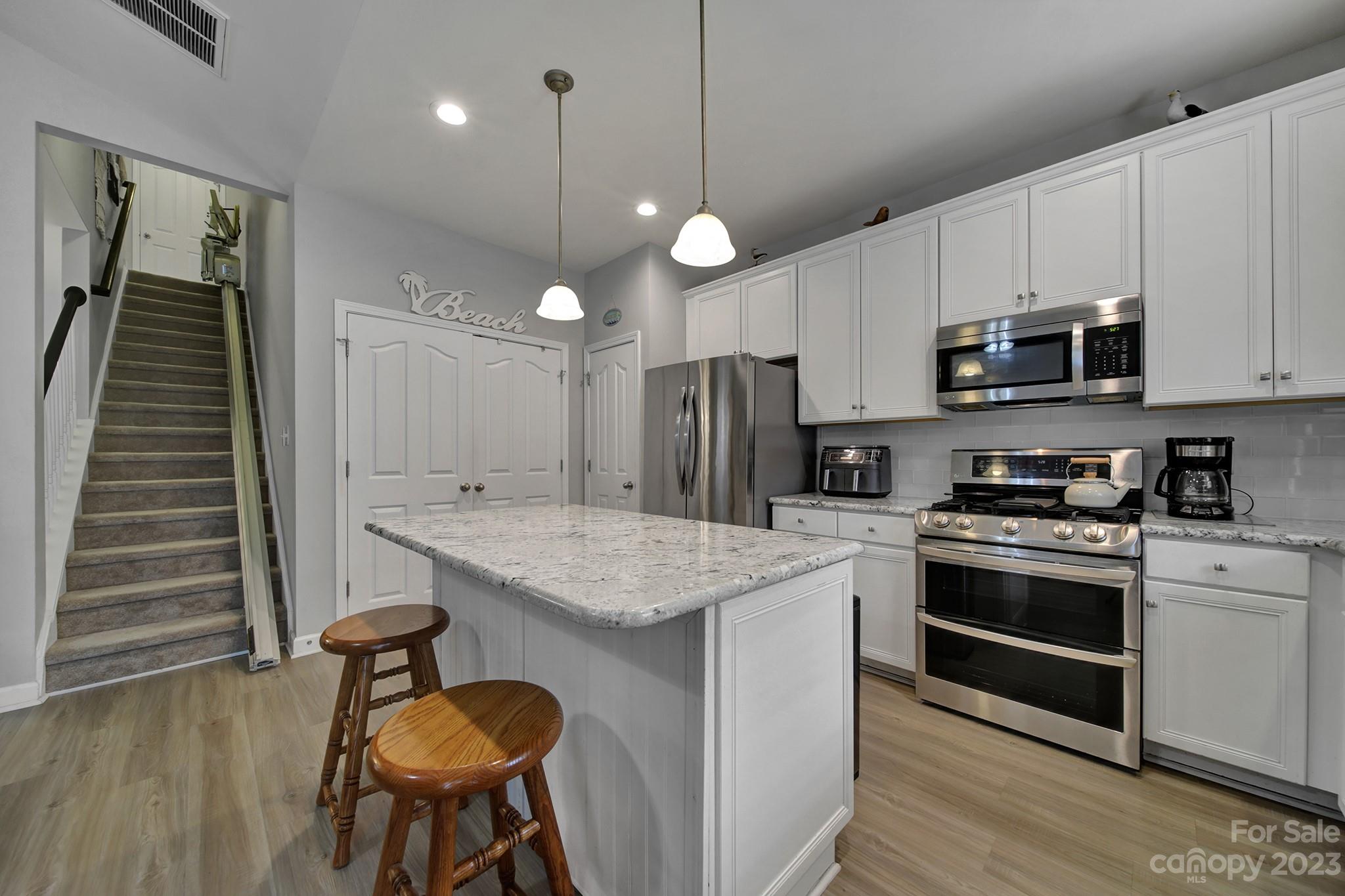 1079 Market Street Fort Mill, SC 29708 - Photo 15 of 46 a kitchen with a stove a refrigerator and a microwave