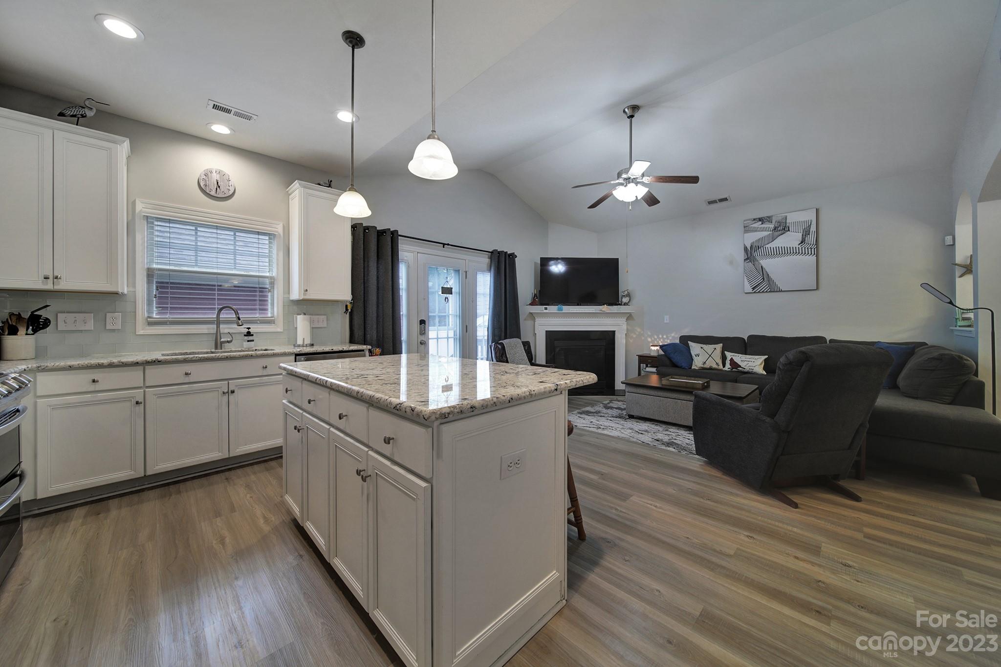 1079 Market Street Fort Mill, SC 29708 - Photo 17 of 46 a kitchen with a sink cabinets and wooden floor