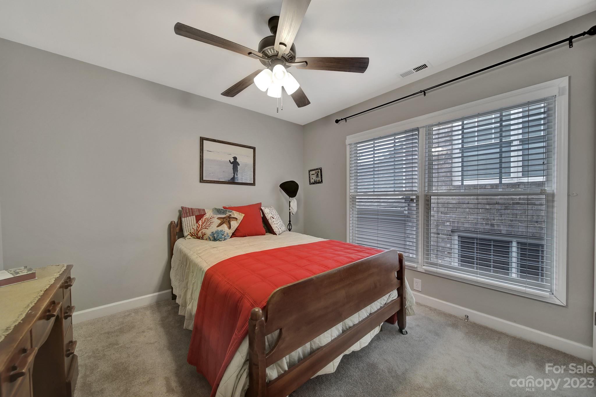 1079 Market Street Fort Mill, SC 29708 - Photo 20 of 46 a bedroom with a bed and a large window