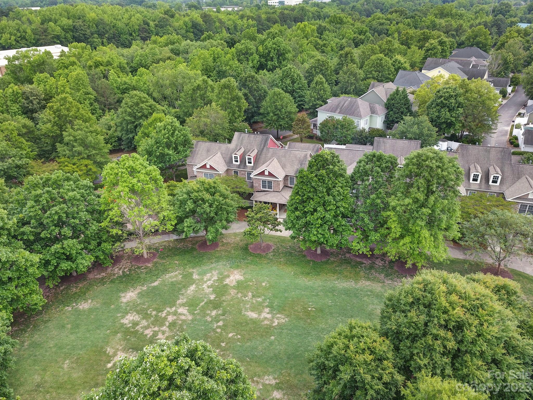 1079 Market Street Fort Mill, SC 29708 - Photo 32 of 46 an aerial view of residential houses with outdoor space and trees all around