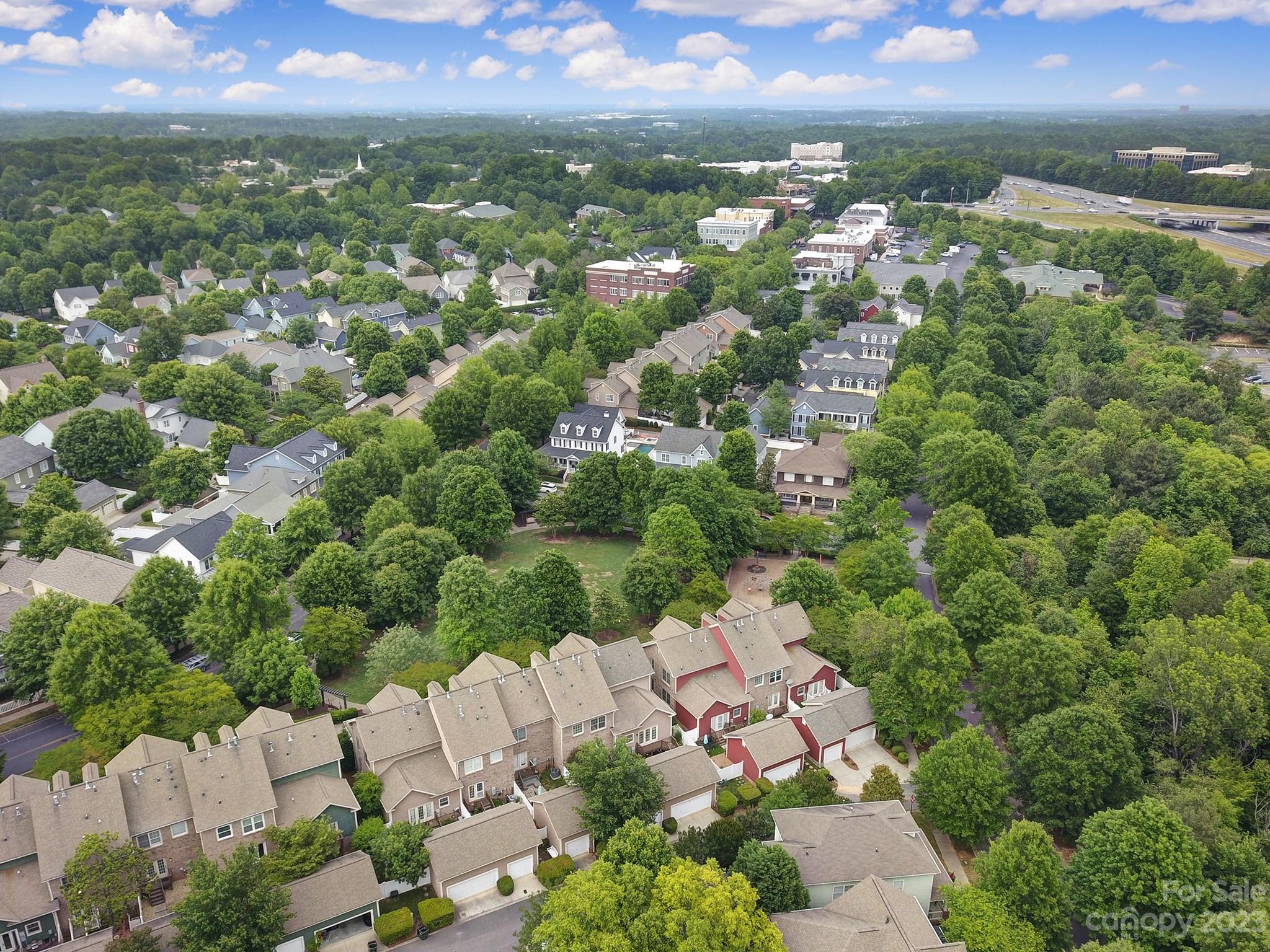 1079 Market Street Fort Mill, SC 29708 - Photo 34 of 46 an aerial view of residential houses with outdoor space and trees