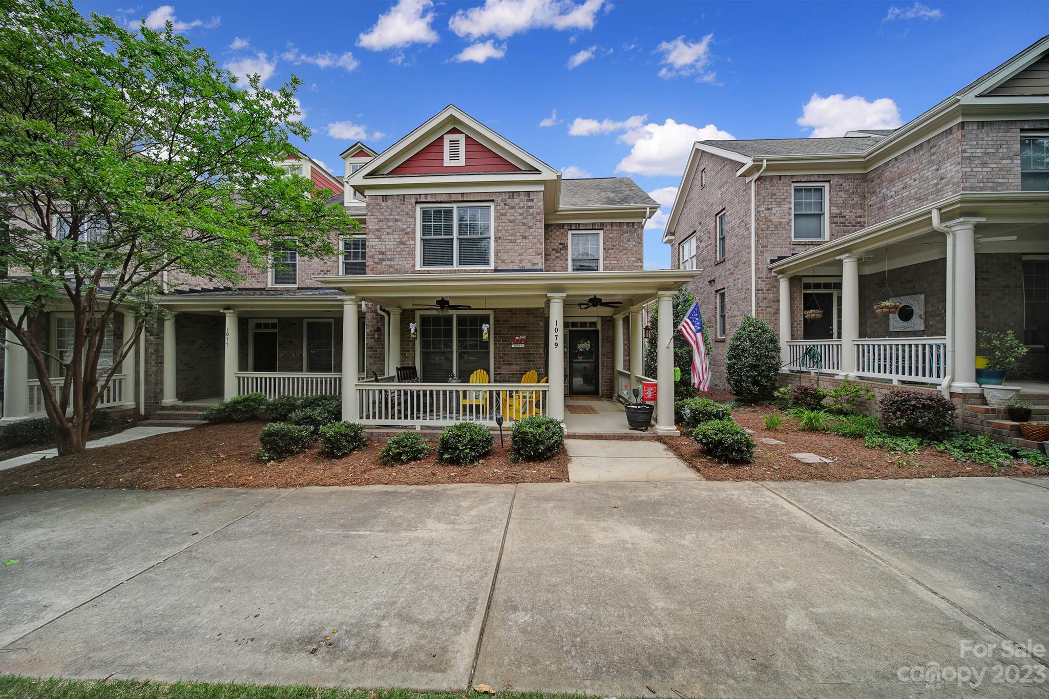1079 Market Street Fort Mill, SC 29708 - Photo 4 of 46 front view of a brick house with a yard