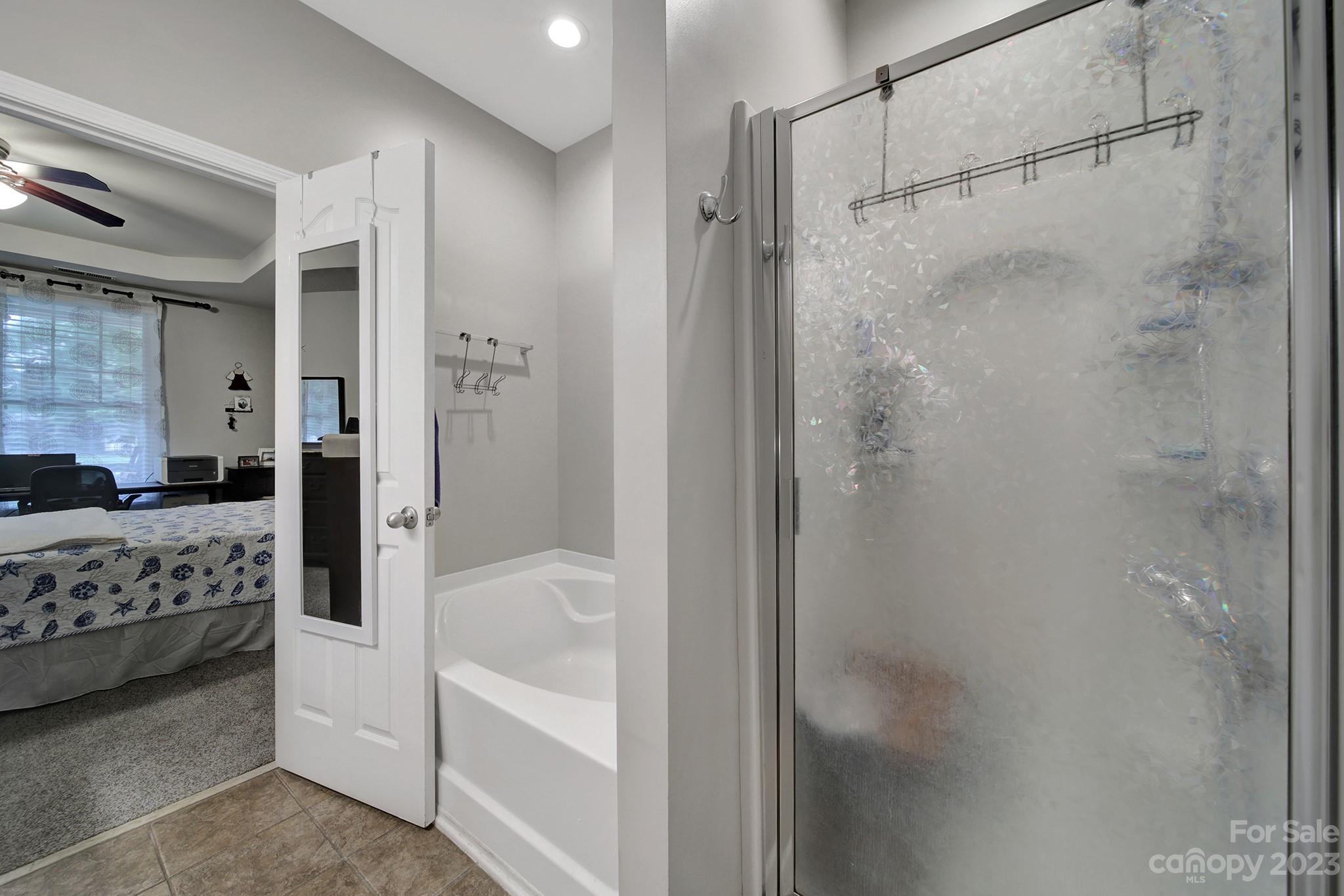 1079 Market Street Fort Mill, SC 29708 - Photo 9 of 46 a bathroom with a bathtub and a shower