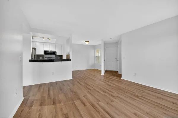 a view of kitchen and wooden floor