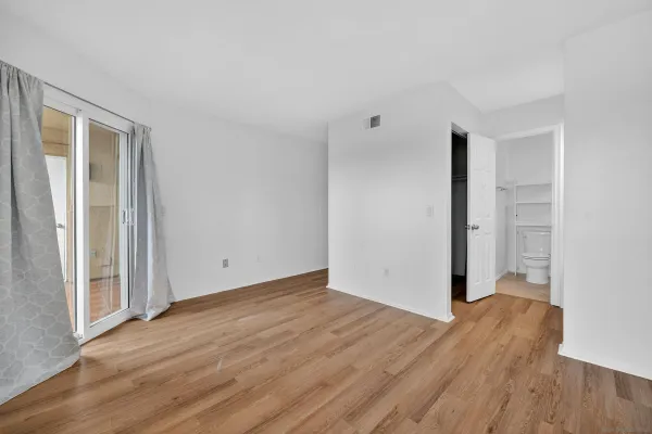 an empty room with wooden floor