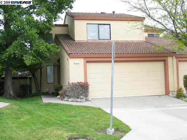 a view of a house with a yard and plants