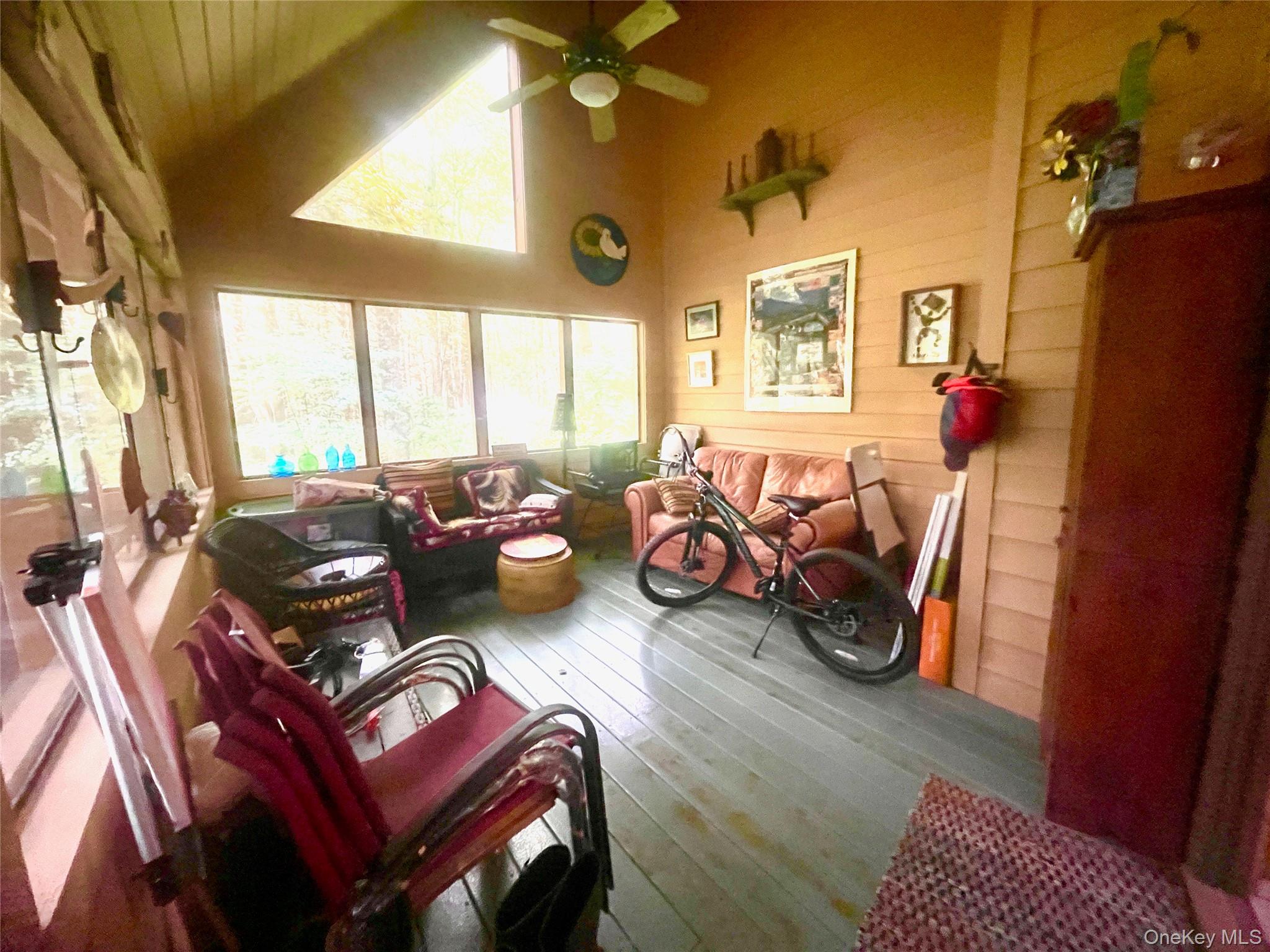 111 Deer Meadow Road Bethel, NY 12786 - Photo 12 of 43 a living room with furniture and a large window
