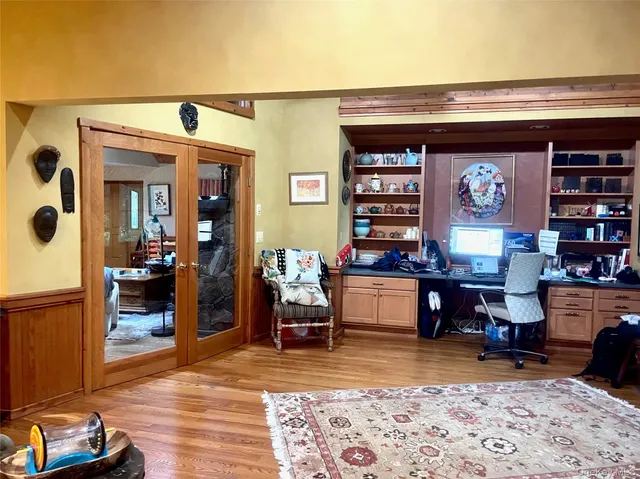 a living room with furniture and a rug