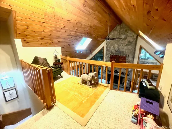 a view of swimming pool with seating area