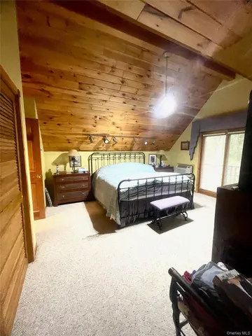 a bedroom with furniture and a window