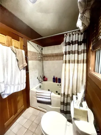 a bathroom with a sink mirror vanity and toilet