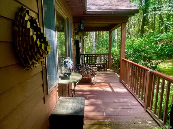 a view of balcony with furniture