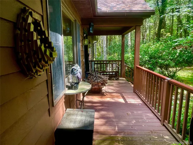 a view of balcony with furniture