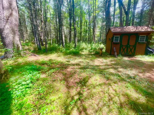 a view of a table and chairs in the garden