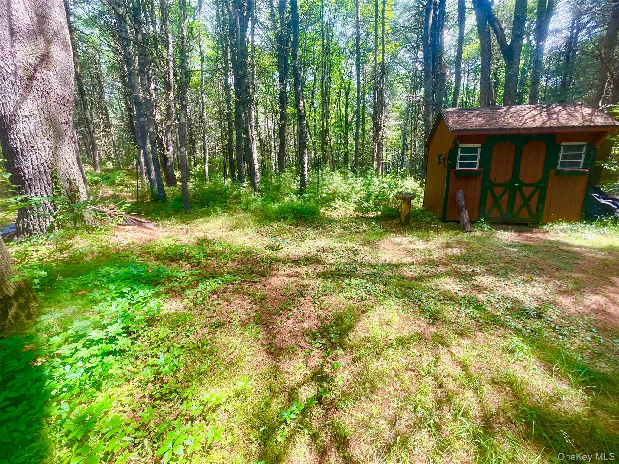 111 Deer Meadow Road Bethel, NY 12786 - Photo 34 of 43 a view of a table and chairs in the garden