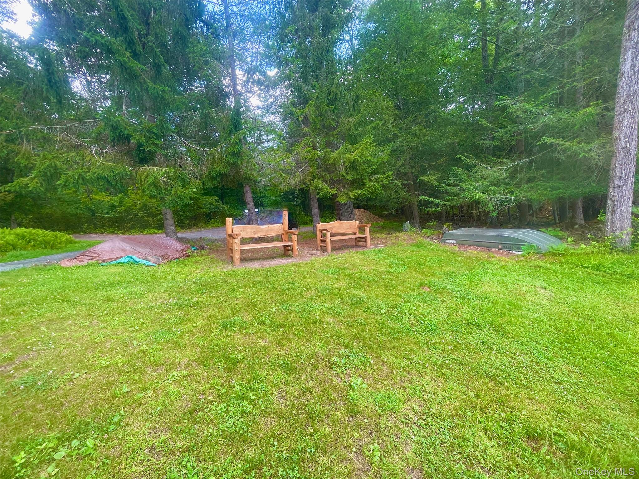 111 Deer Meadow Road Bethel, NY 12786 - Photo 43 of 43 a view of a backyard with a bench