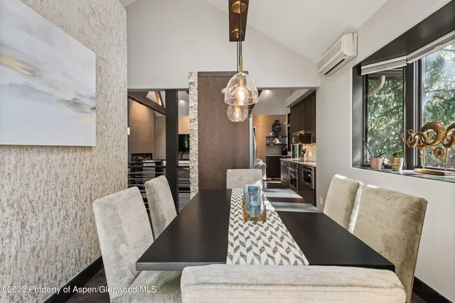 a view of chairs and a table in the balcony