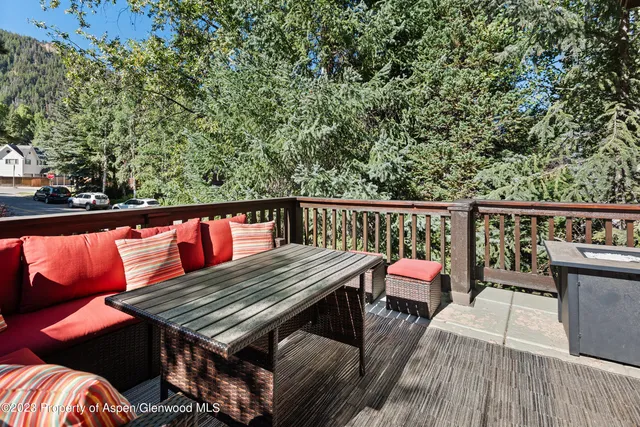 a bathroom with a granite countertop sink toilet a large mirror a bathtub and window