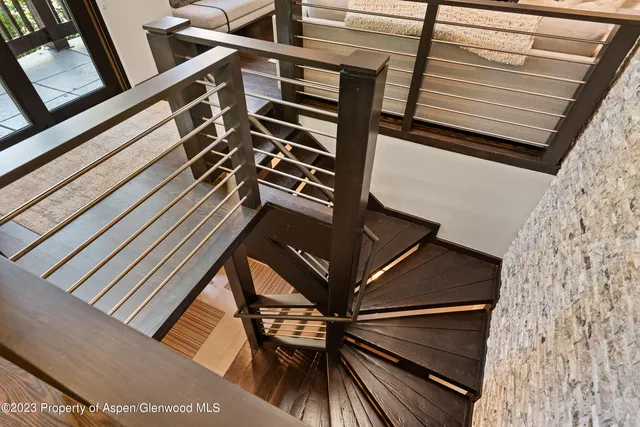 a bedroom with a bed and a fireplace