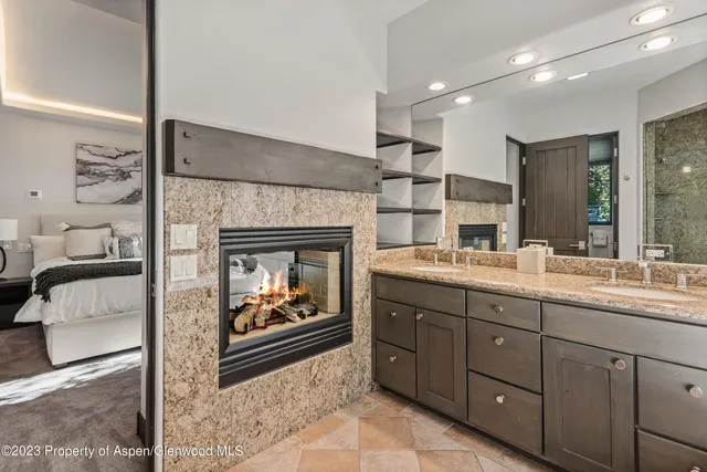 a bedroom with a bed and lamp