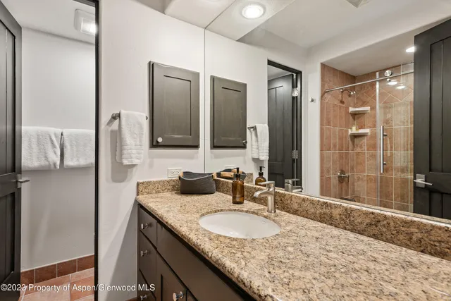 a bedroom with bed and window