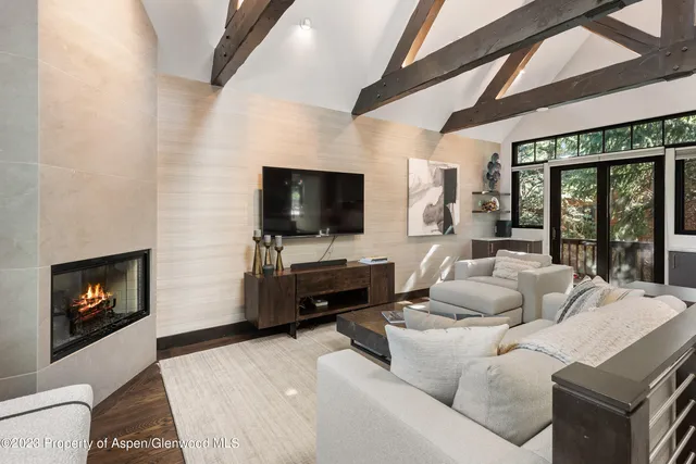 a living room with furniture and a flat screen tv