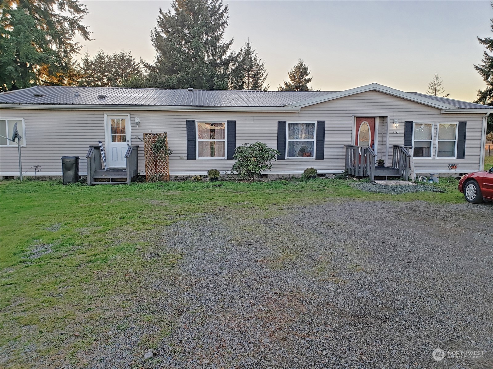 7130 196th Avenue Southwest Rochester, WA 98579 - Photo 1 of 36 a view of a yard in front of a house