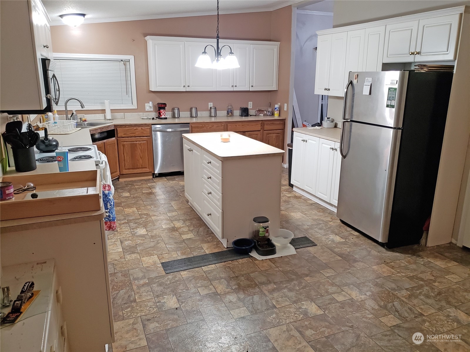7130 196th Avenue Southwest Rochester, WA 98579 - Photo 19 of 36 a kitchen with a refrigerator sink and stove