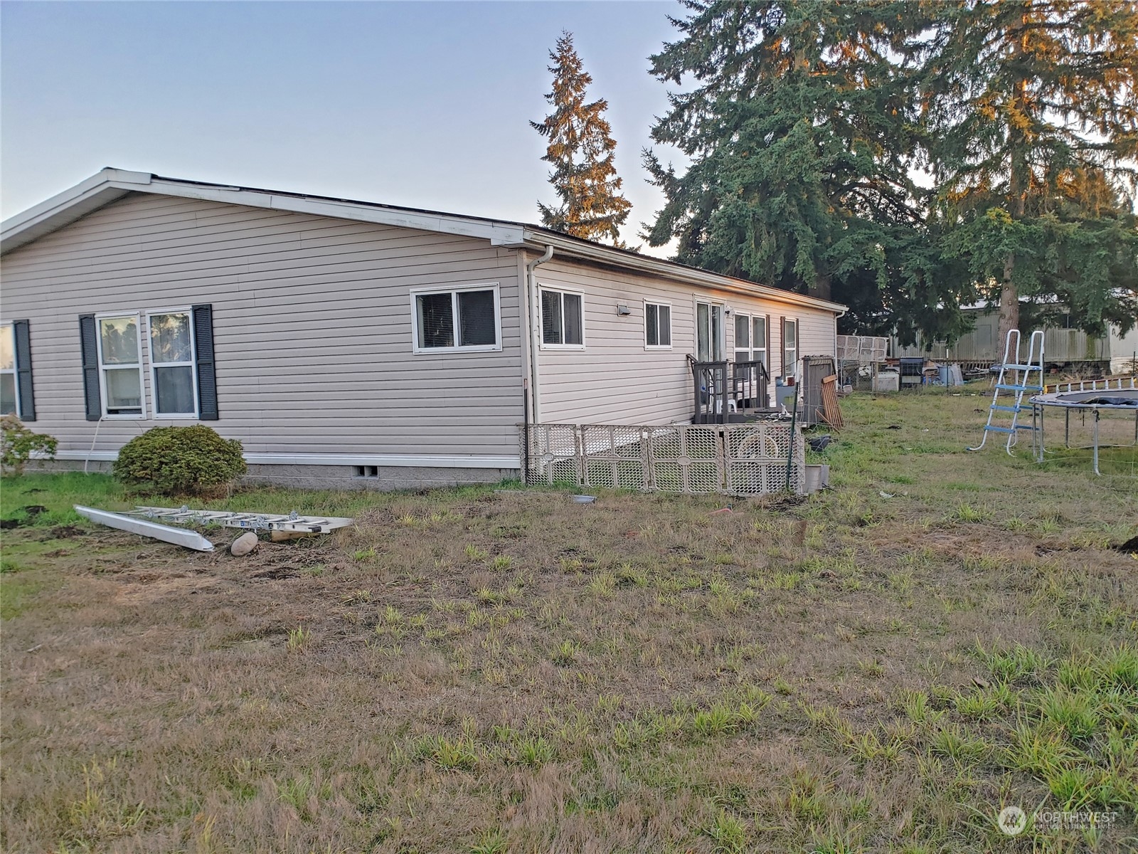 7130 196th Avenue Southwest Rochester, WA 98579 - Photo 31 of 36 a view of a house with a yard