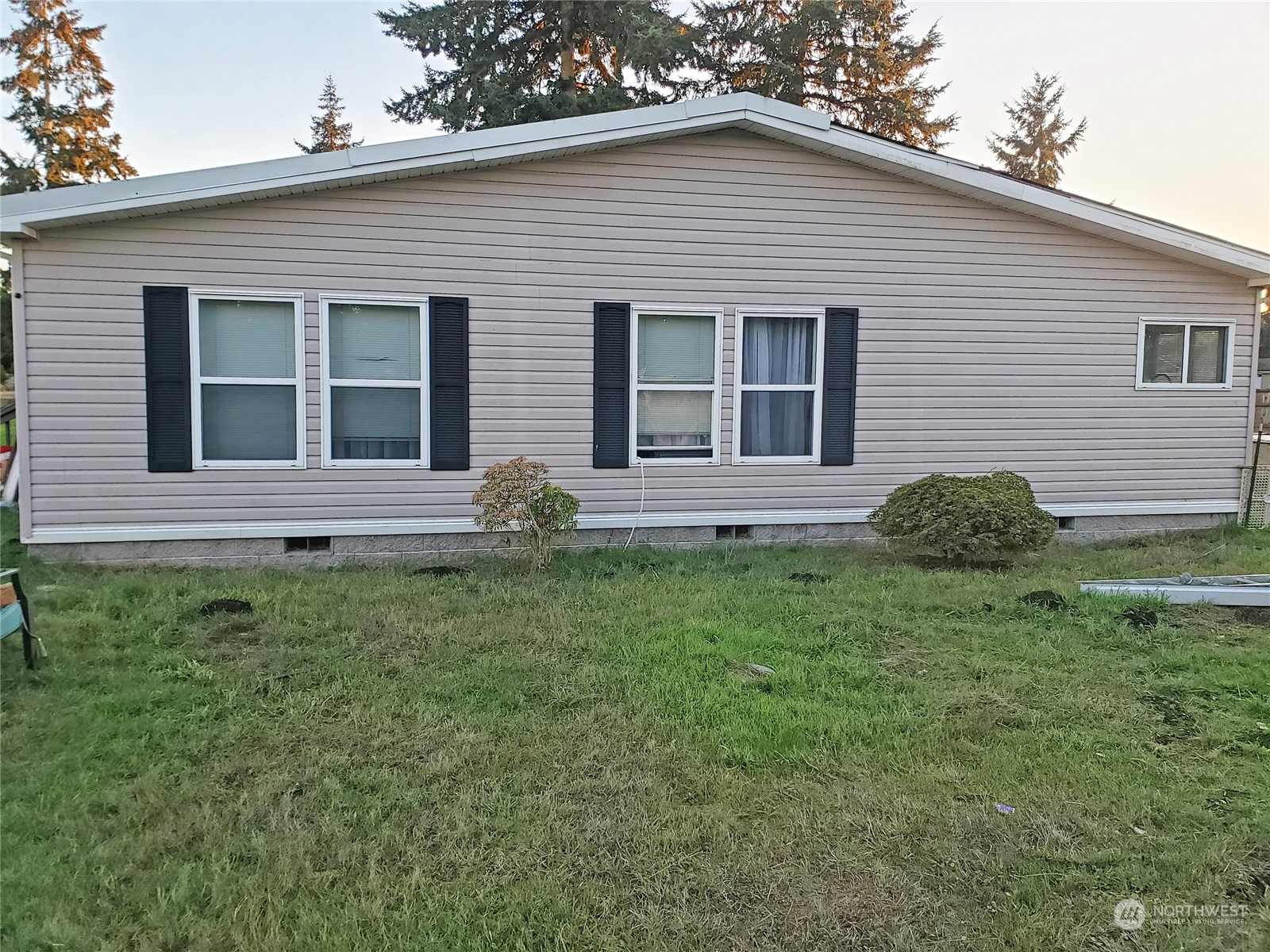 7130 196th Avenue Southwest Rochester, WA 98579 - Photo 32 of 36 a view of house with a yard