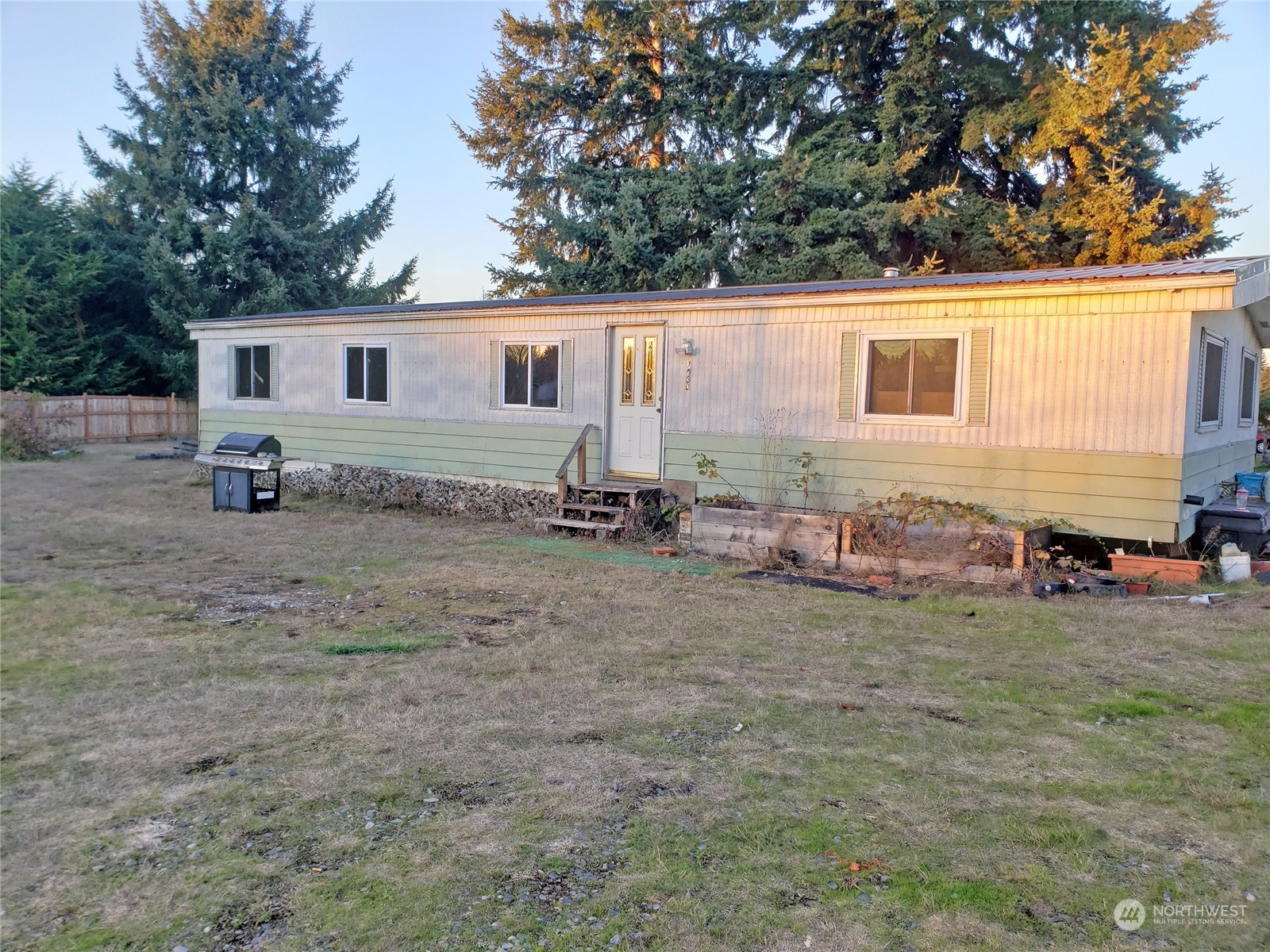 7130 196th Avenue Southwest Rochester, WA 98579 - Photo 36 of 36 a view of a backyard with a car parked in front of it