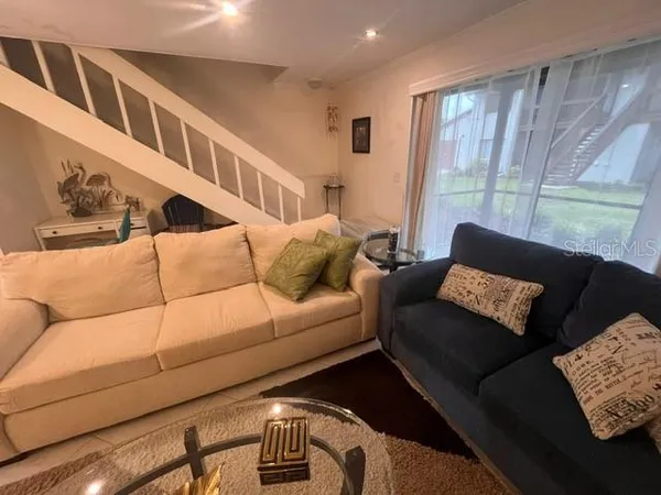a living room with furniture and a window