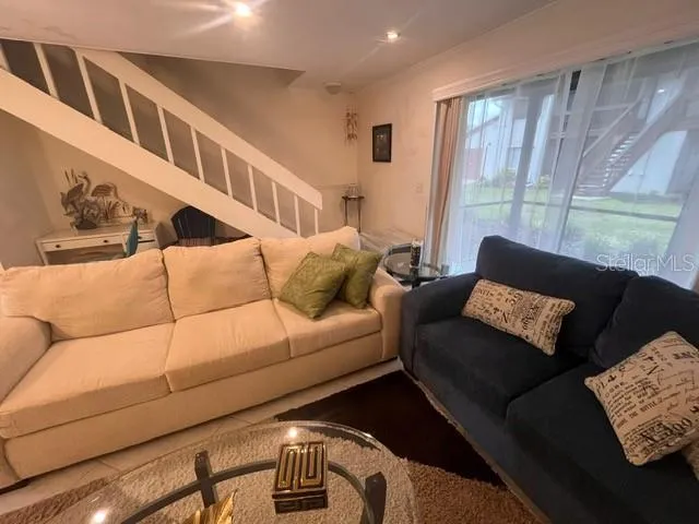 a living room with furniture and a window