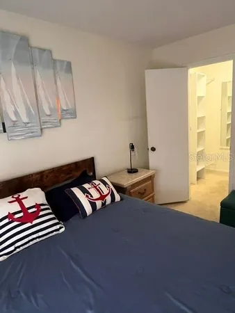 a bedroom with a bed and furniture